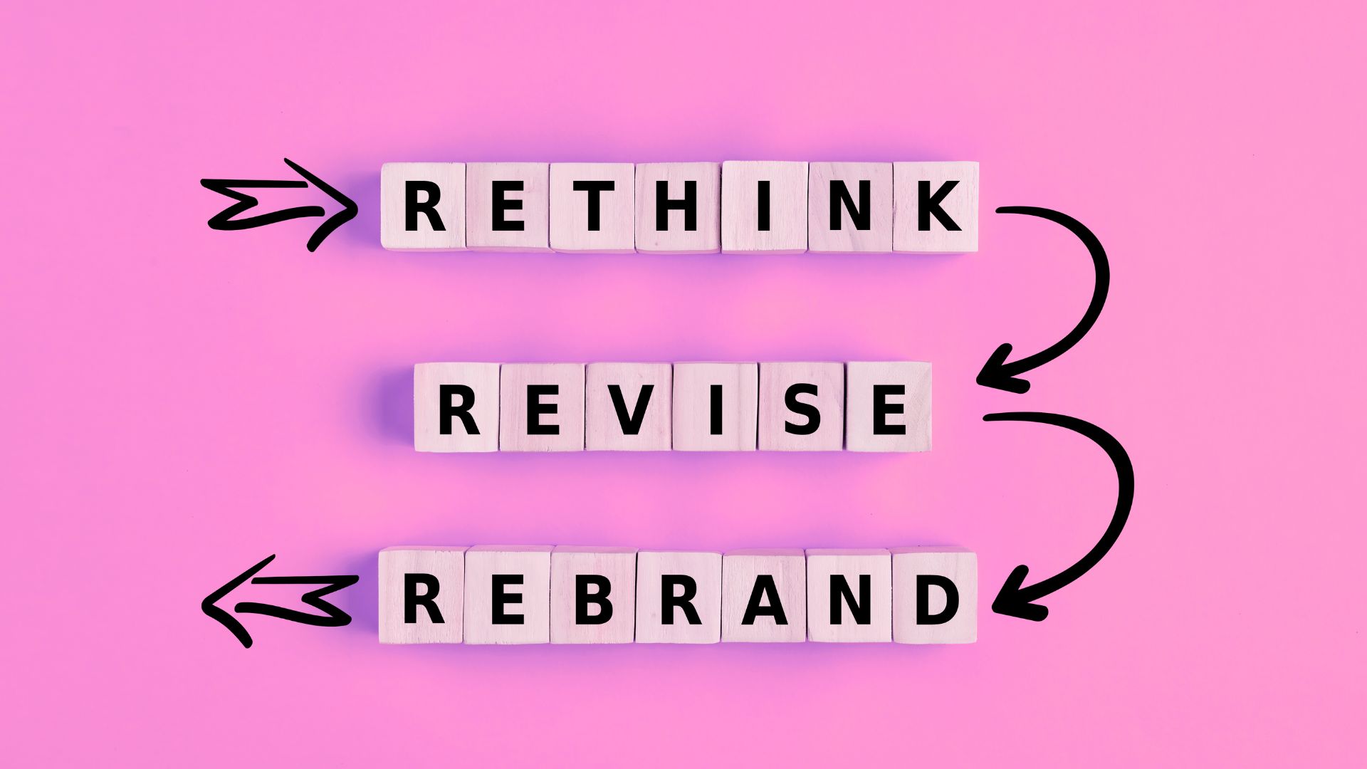 the words rethink, revise, rebrand written in blocks. Cocktail Creative