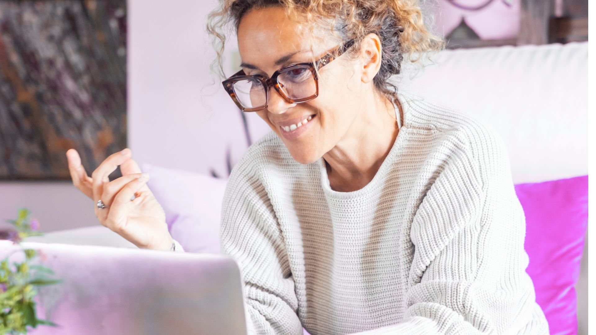 Happy lady looking at a website, Cocktail Creative, Brand Boosters
